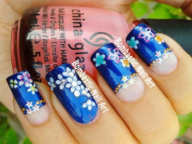 Blue Nails With Colorful Flowers And Half Moon Nail Art Design Idea