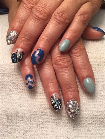 Blue Negative Space Nail Art And Bling Design