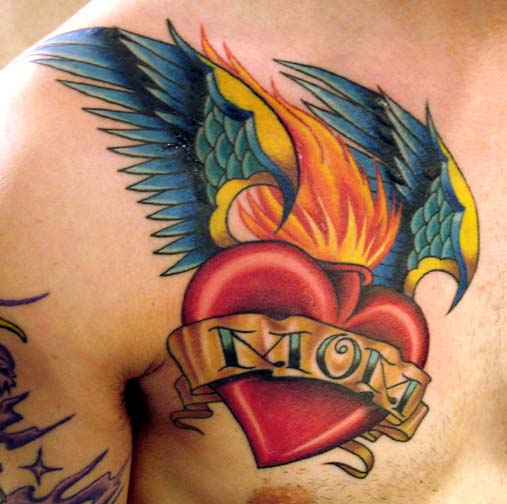 Burning Winged Mom Heart Tattoo On Chest