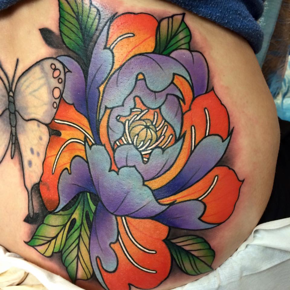 Colored Flowers And Butterfly Tattoo On Back