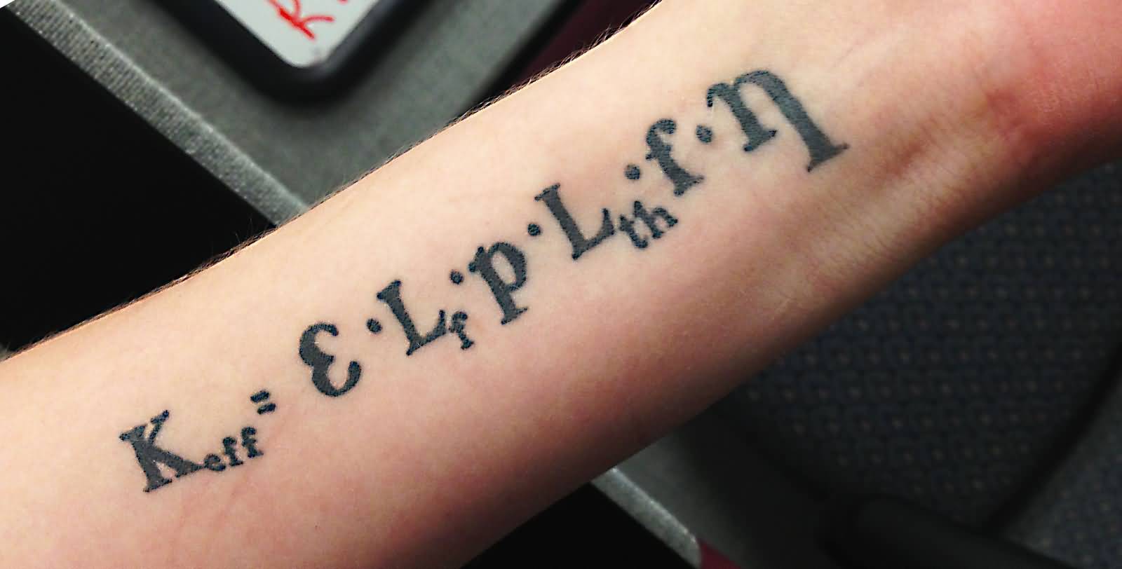 Dark Black Equation Tattoo On Forearm