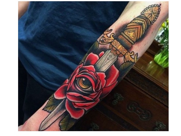 Golden Dagger With Eye On Rose Colored Tattoo