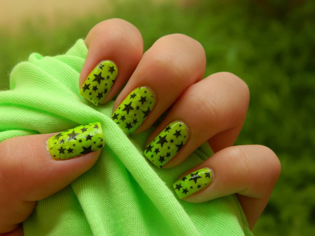 10. "Rebellious Black and Neon Nail Design with Graffiti Accents" - wide 7