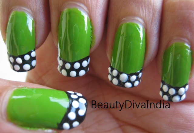 Green Nails With Black And White Polka Dots Nail Art