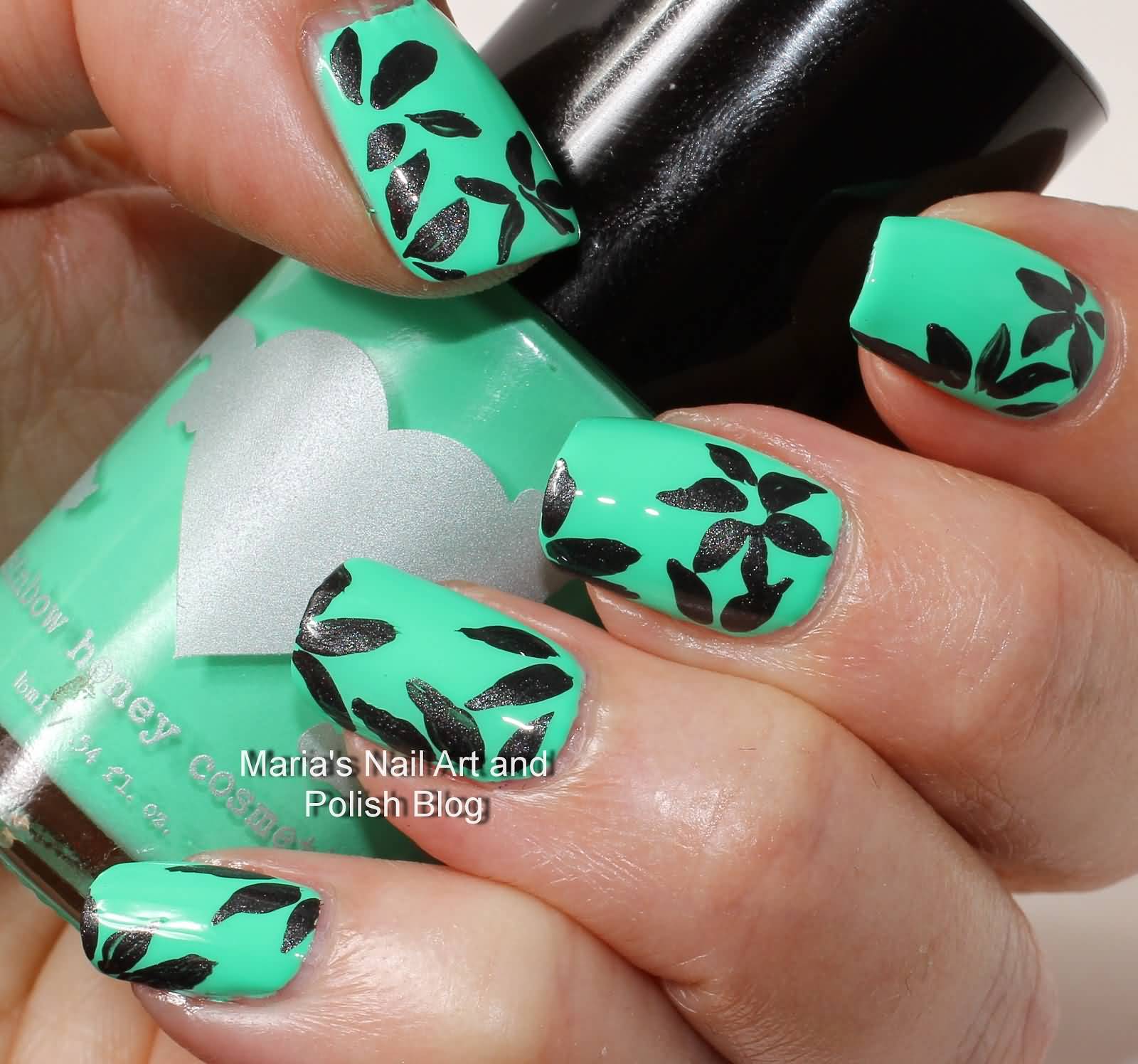 Green Nails With Black Flower Nail Art