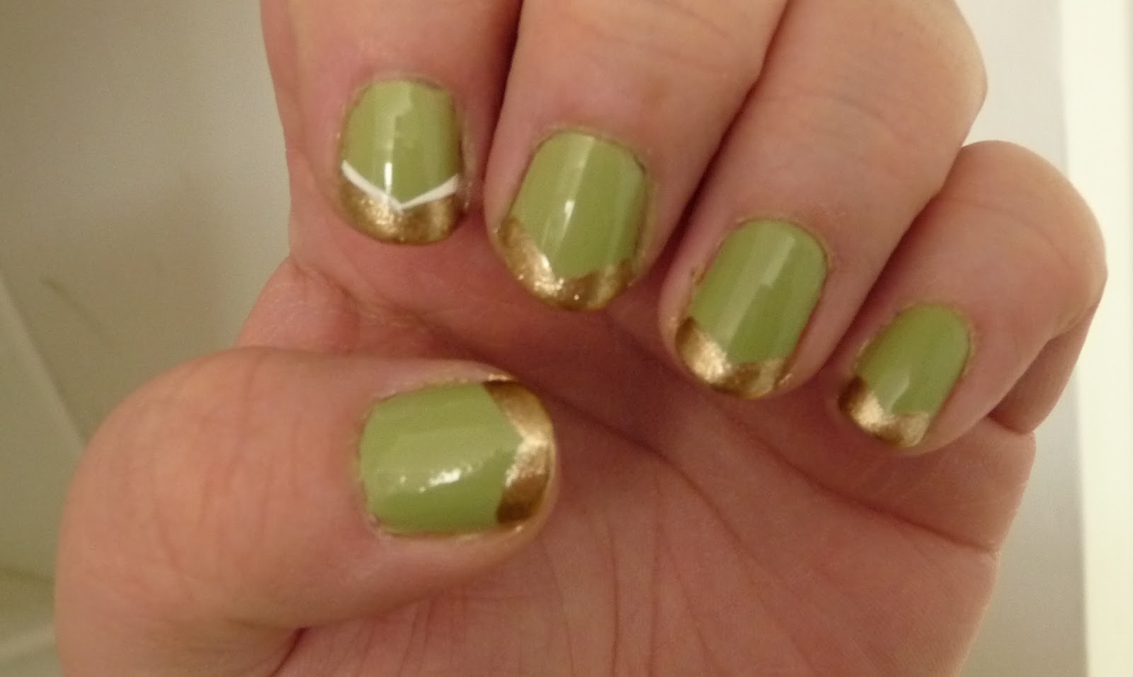 Green Nails With Gold French Tip Nail Art