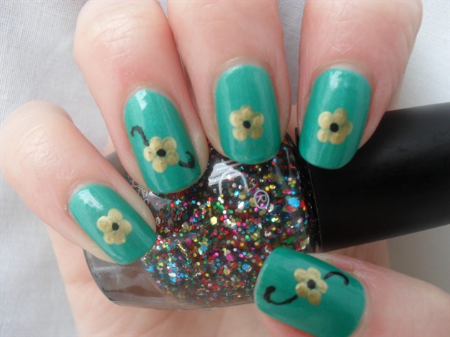 Green Nails With Gold Shamrock Flowers Nail Art