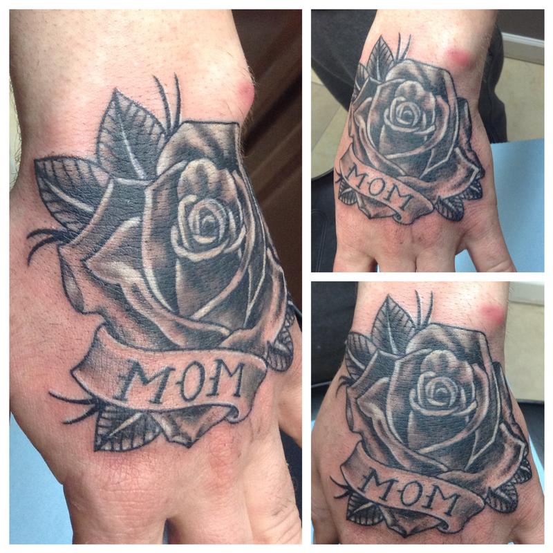 Grey And Black Mom Rose Tattoo On Hand