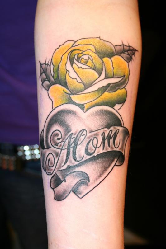 Grey Mom Heart And Yellow Rose Tattoo On Forearm.