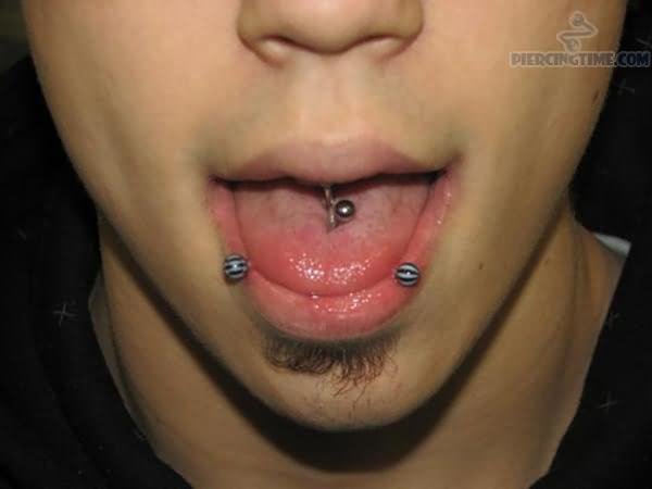 Horizontal And Vertical Multiple Tongue Piercing For Girls