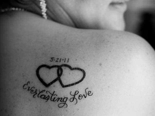 Interlocking Love Tattoo On Back Right Shoulder
