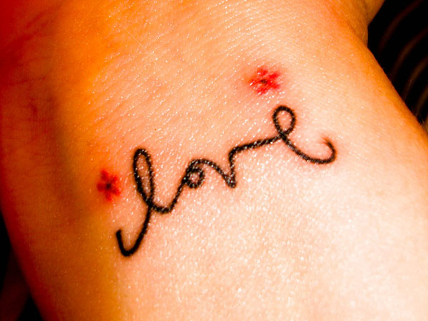 Love And Tiny Flowers Tattoo On Wrist