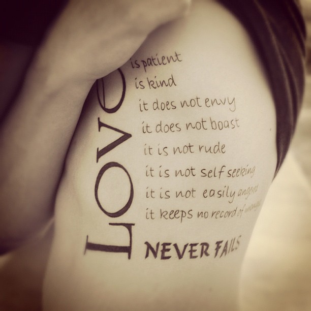 Love Quote Tattoo On Side Rib