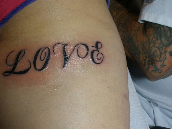 Love Tattoo On Forearm