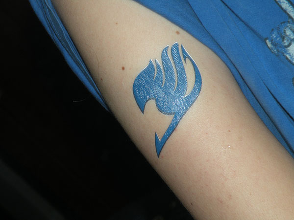 Lovely Blue Fairy Tail Tattoo On Sleeve
