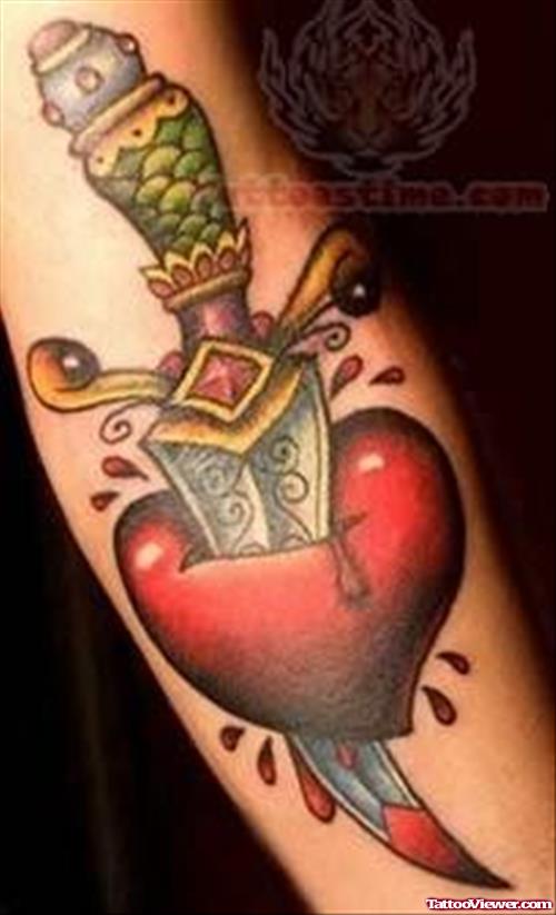 Lovely Dagger Ripped Heart Tattoo On Forearm