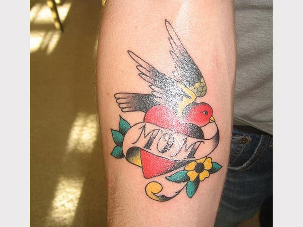 Lovely Mom Heart With Bird Traditional Tattoo On Forearm