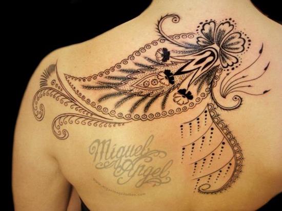 Lovely Paisley Flower Pattern Tattoo On Upper Back