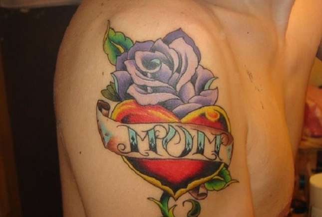 Mom Banner On Heart With Flower Tattoo On Right Shoulder