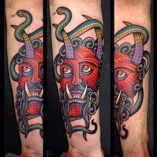 Mosaic Evil And Snake Tattoo On Forearm