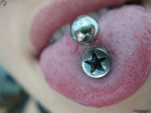 Multiple Tongue Piercing Star And Silver Studs