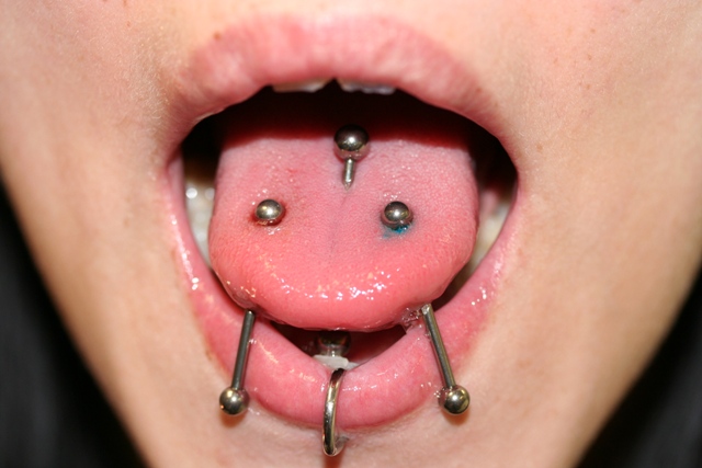 Sale triple tongue piercing is stock