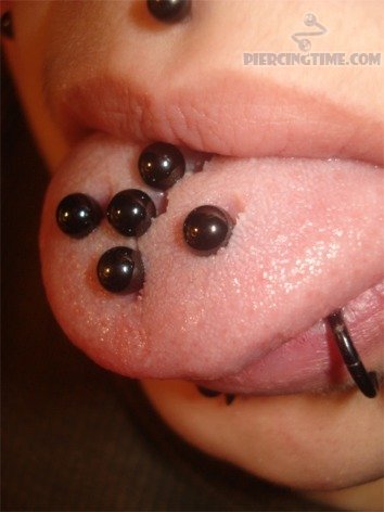 Multiple Tongue Piercing With Black Studs
