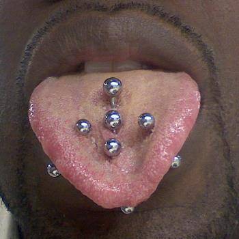 Multiple Tongue Piercing With Five Silver Studs
