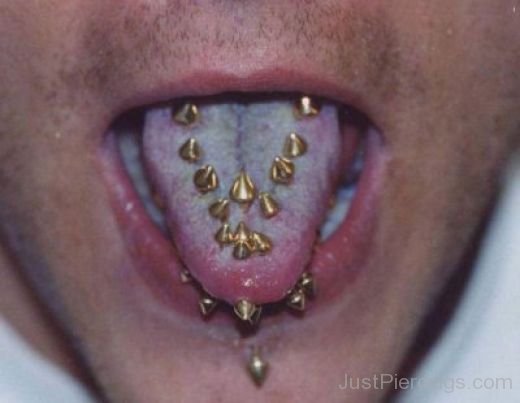 Multiple Tongue Piercing With Gold Spike Studs
