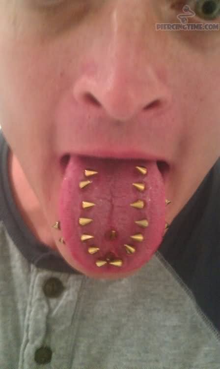 Multiple Tongue Piercing With Gold Studs