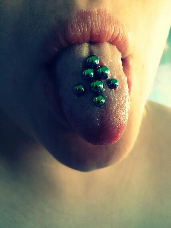 Multiple Tongue Piercing With Green Studs