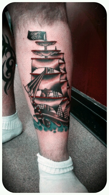 Nice Colored Jolly Roger Ship Tattoo On Leg