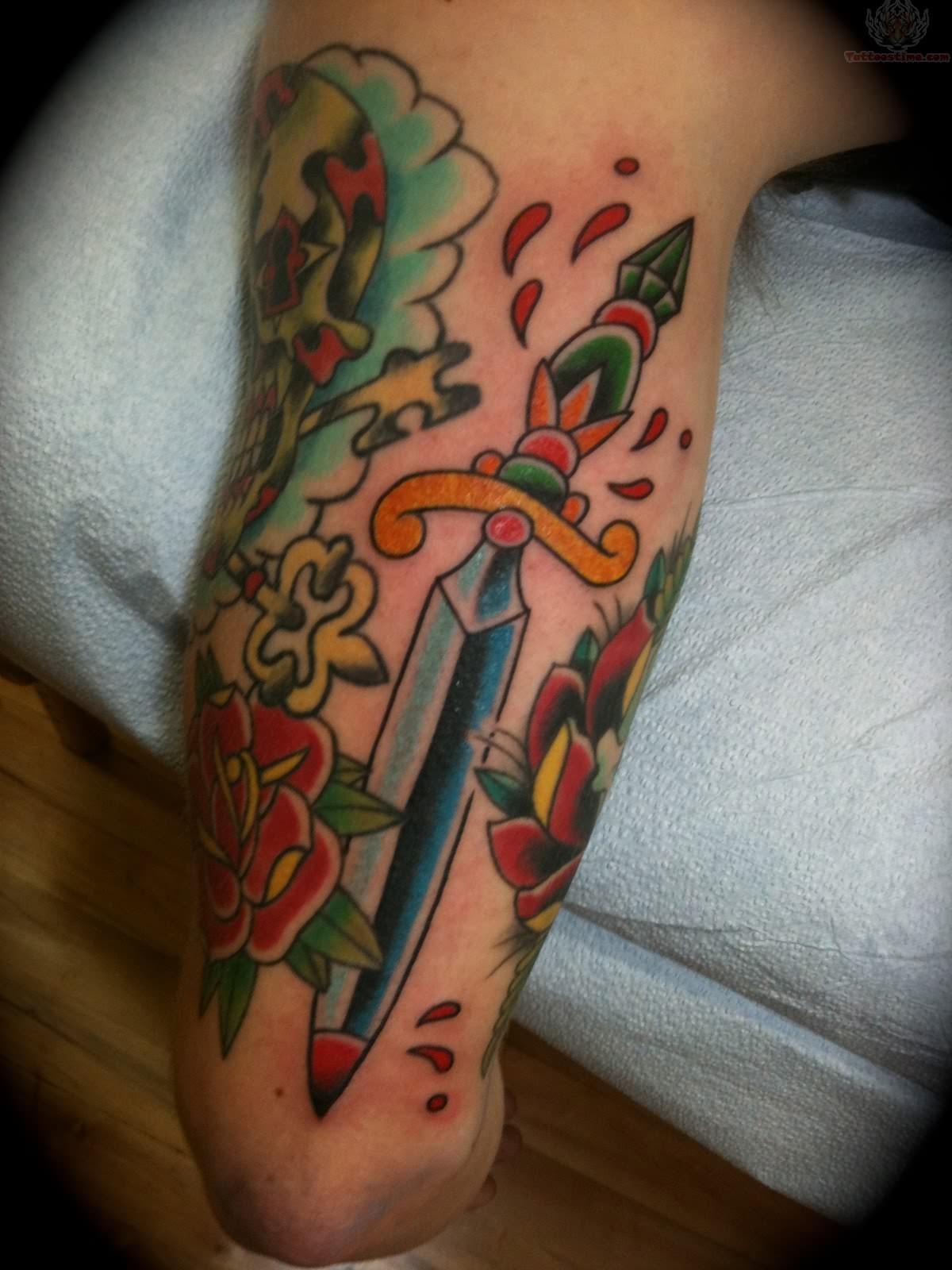Nice Dagger Traditional Tattoo On Half Sleeve