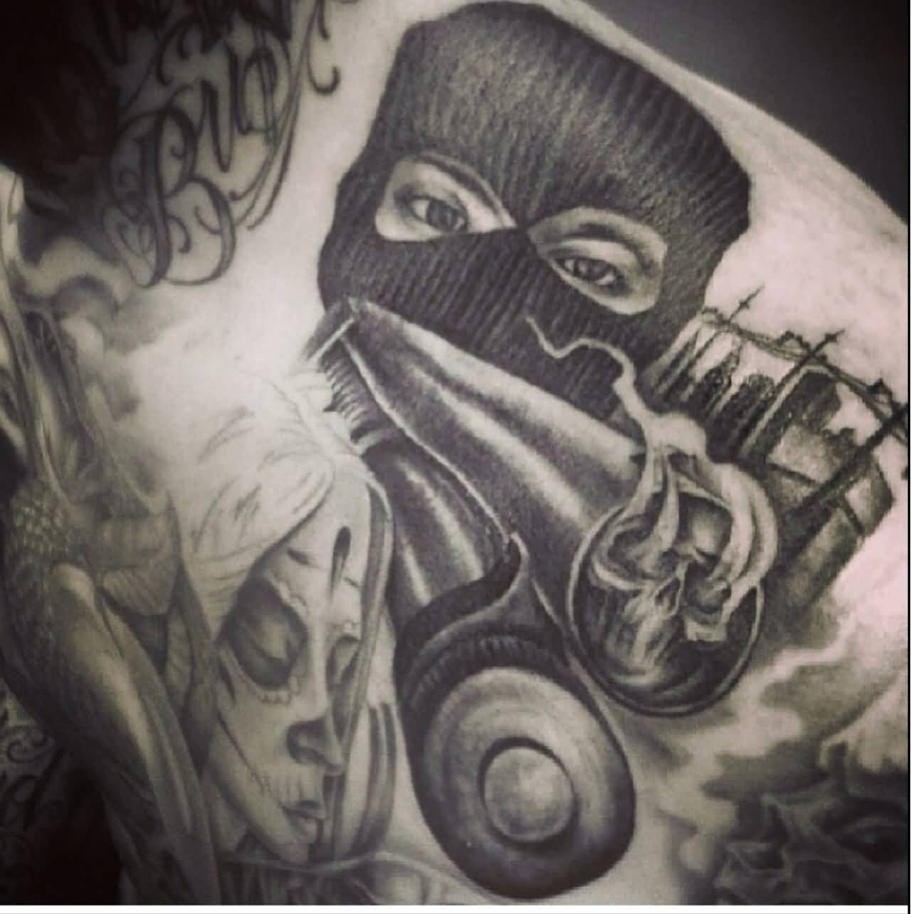 Nice Gangsta Wearing Mask Tattoo On Shoulder