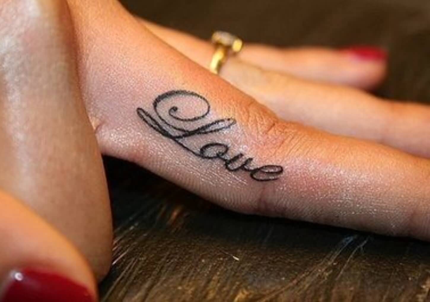 Nice Love Word Tattoo On Finger