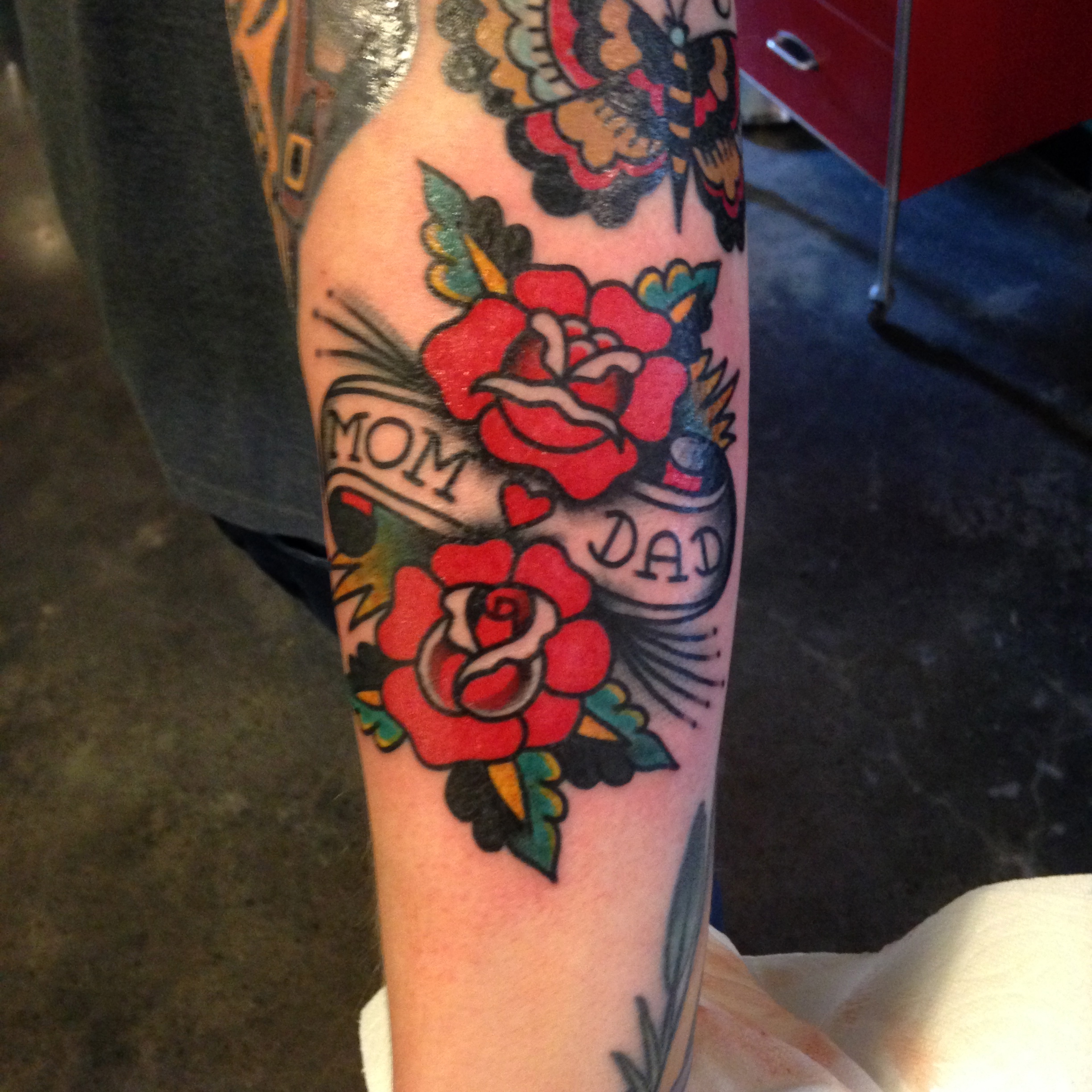 Nice Traditional Mom Dad Rose Flowers Tattoo