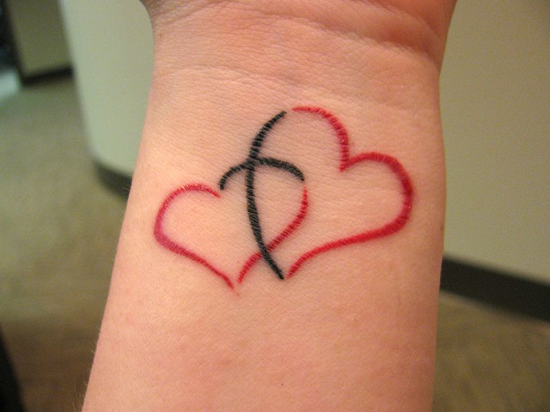 Nice Two Joined Hearts Tattoo On Wrist