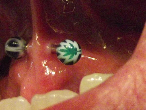Oral Tongue Web Piercing With Marijuana Barbell