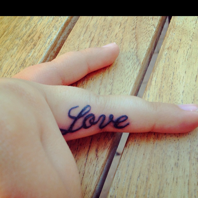 Purple Love Word Tattoo On Finger