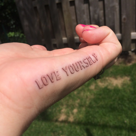 Realistic Self Love Tattoo On Finger