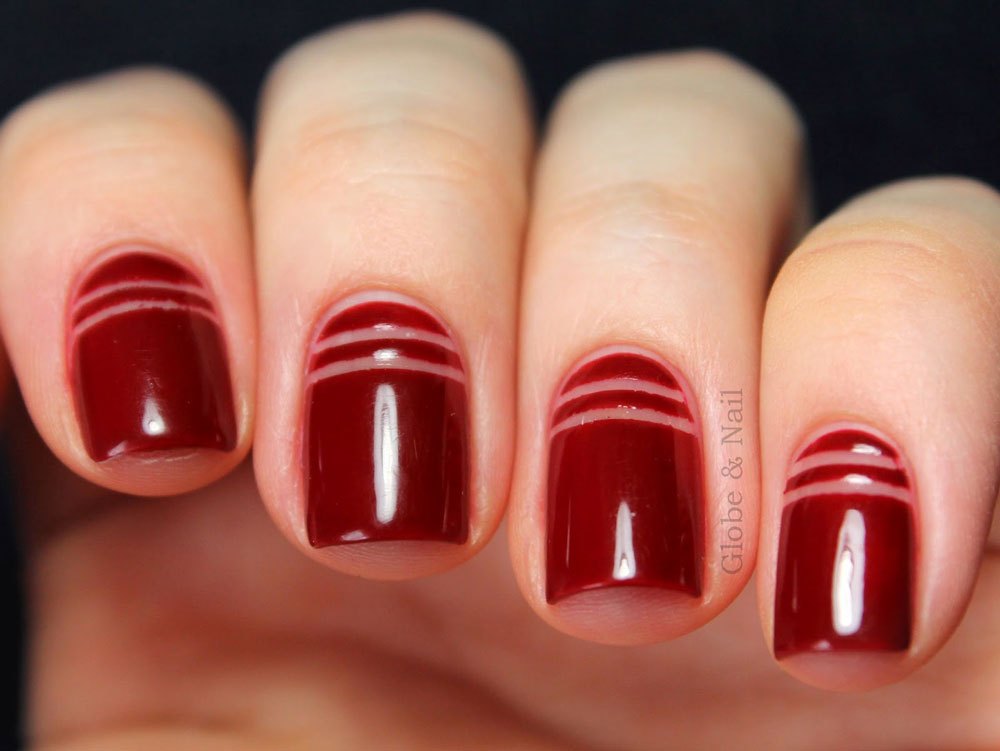 Red Nails With Negative Space Stripes Nail Art Design Idea