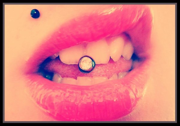 Right Monroe And Oral Tongue Piercing