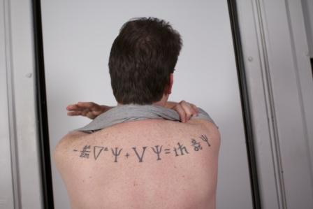 Schrodinger Equation Tattoo On Upper Back