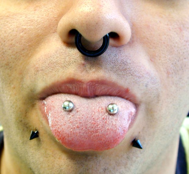 Septum And Multiple Tongue Piercing With Silver Studs