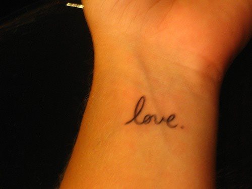 Simple Love Word Tattoo On Wrist