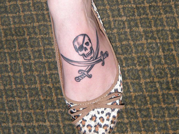 Small Grey Jolly Roger Tattoo On Foot