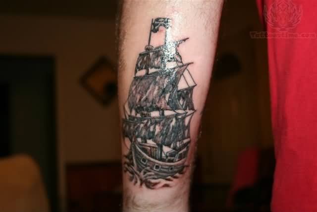 Small Jolly Roger Ship Tattoo On Forearm