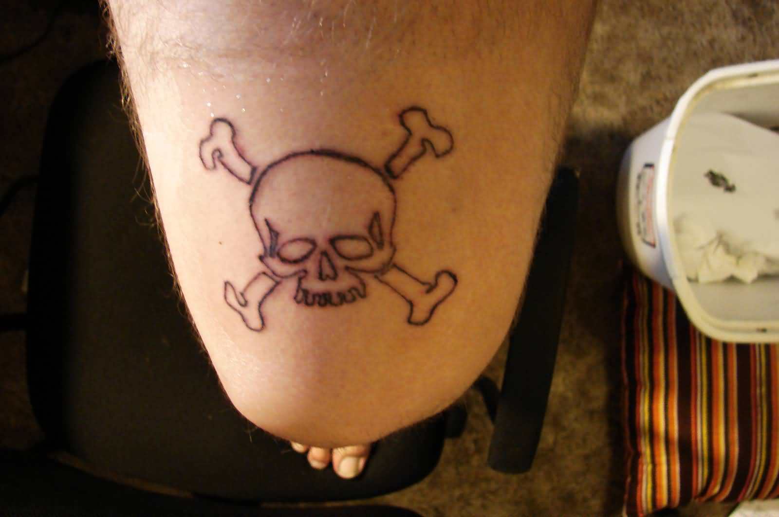 Small Jolly Roger Tattoo On Thigh