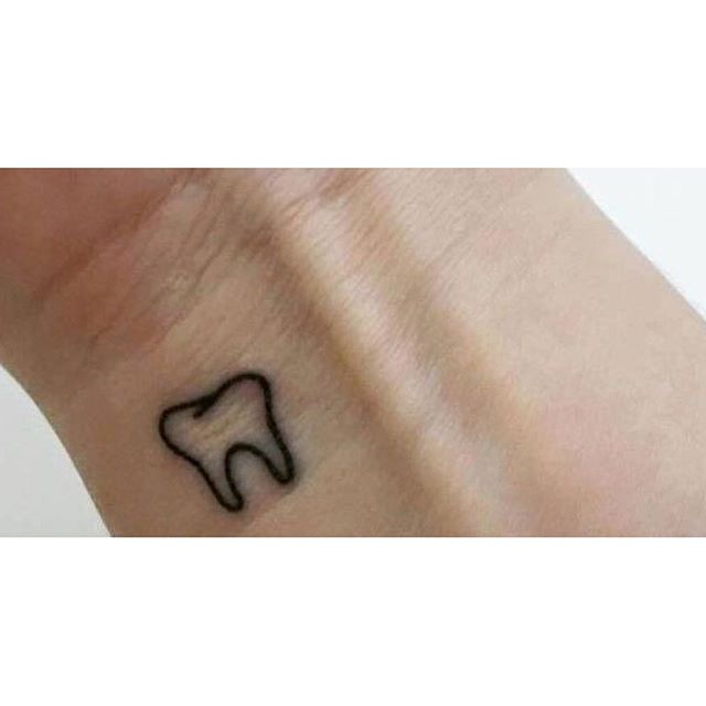 Smallest Molar Tooth Tattoo On Wrist