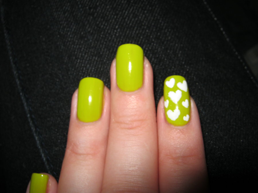 Soothing Green Nails With White Hearts Nail Art Design Idea